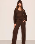 Model is wearing Recycled Sweater Pant  in  Chocolate
