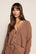 Model is wearing Recycled Sweater Cropped Cardigan  in  Hazelnut