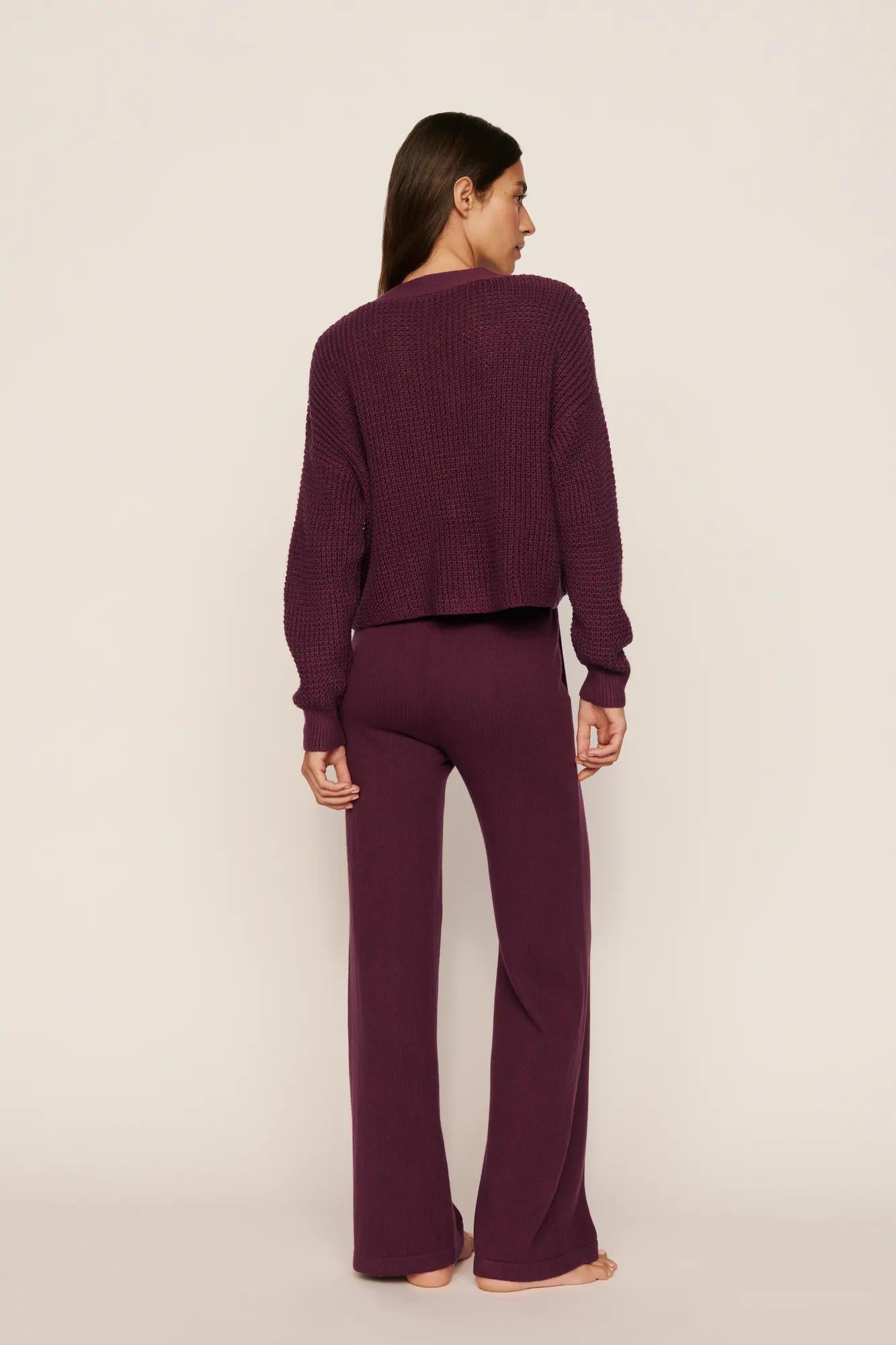 Model is wearing Recycled Sweater Pant in Wildberry
