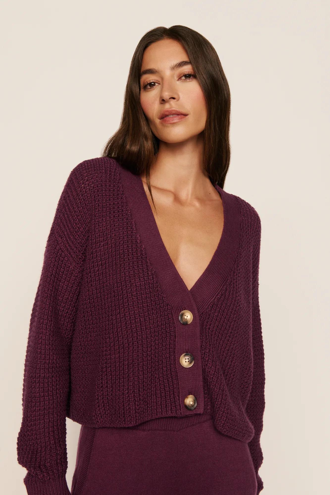 Model is wearing Recycled Sweater Cropped Cardigan in Wildberry