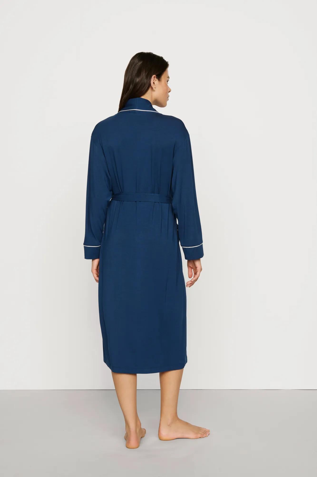 Model is wearing Gisele TENCEL™ Modal Long Robe in Navy/Ivory