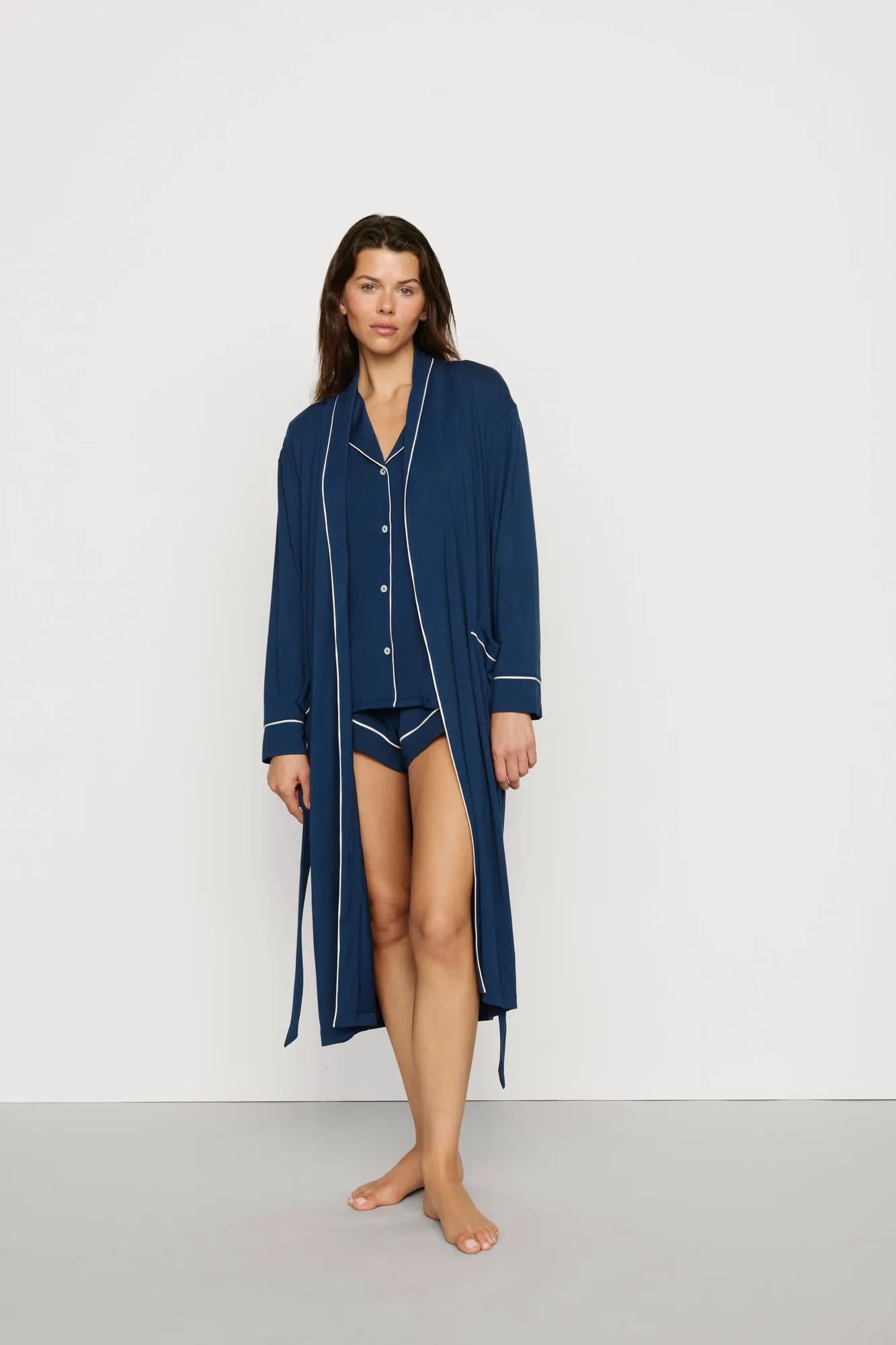Model is wearing Gisele TENCEL™ Modal Long Robe in Navy/Ivory
