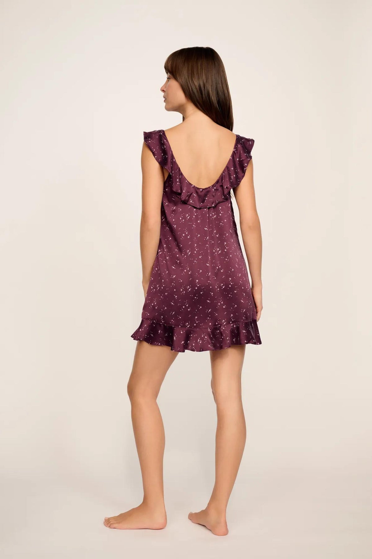 Model is wearing Washable Silk Printed Ruffle Babydoll in Starlight Wildberry