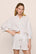 Model is wearing Linen Blend Relaxed Short in SummerDaisyWhite/PeachDust