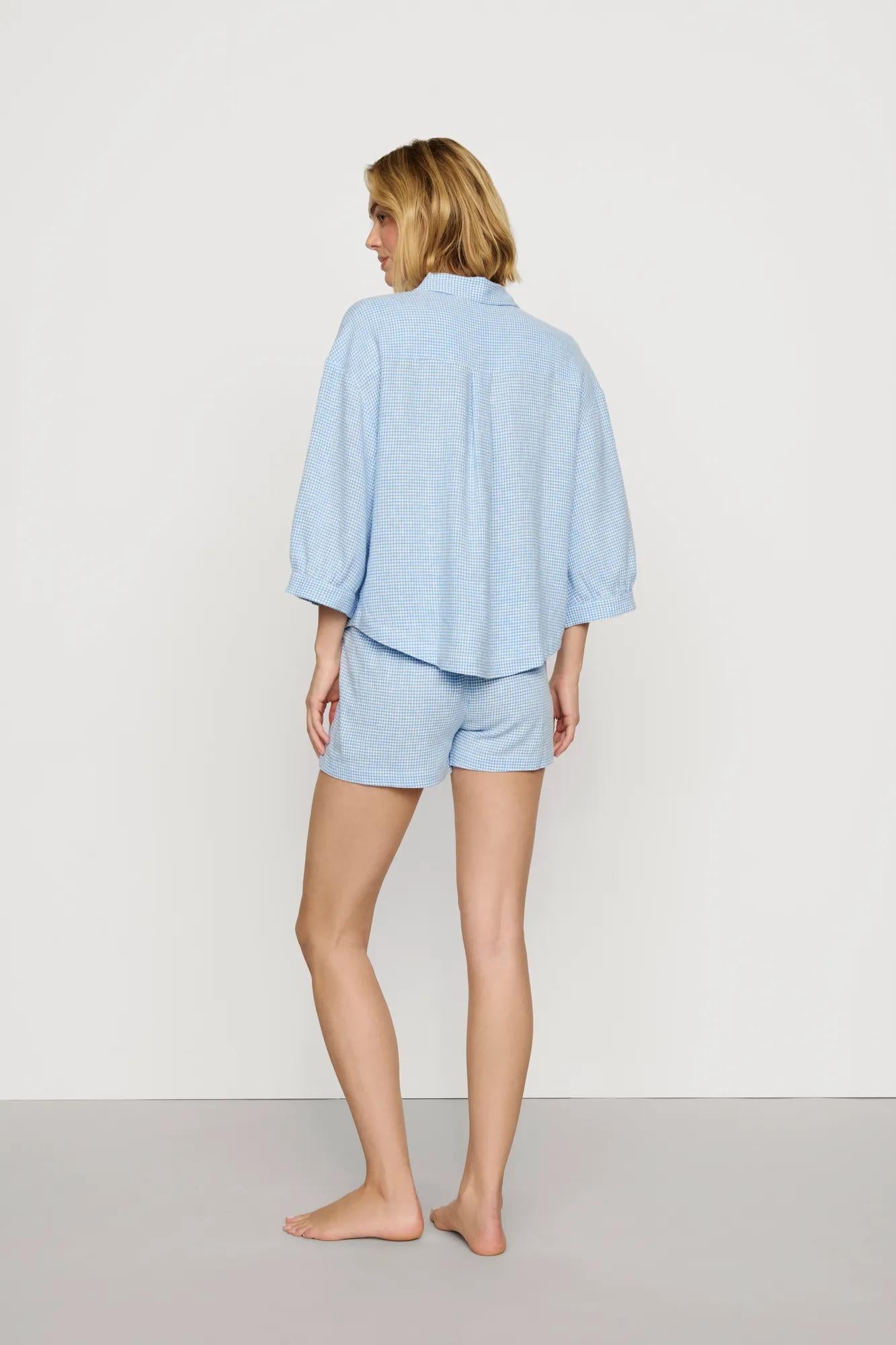 Model is wearing Linen Blend Relaxed Short in Gingham White/Summer Blue