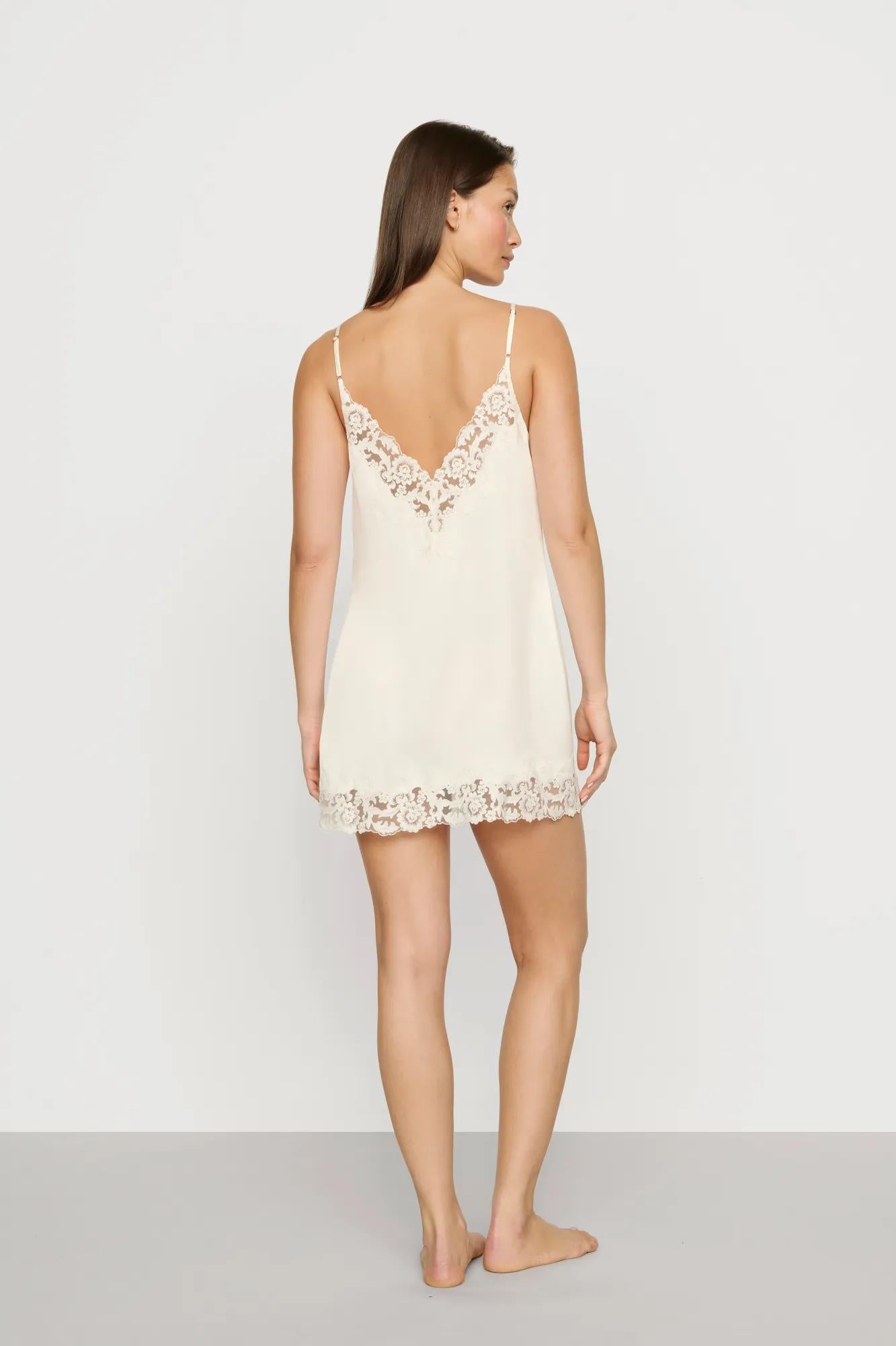 Model is wearing Washable Silk with Lace Embroidery Short Slip in Ivory