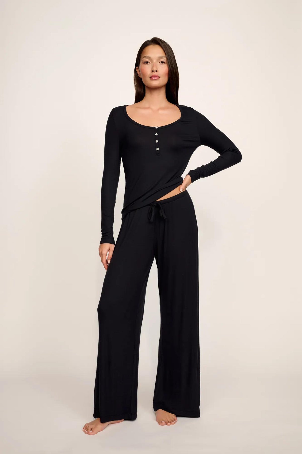 Model is wearing Dream Rib V Neck Tank in Black