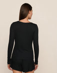 Model is wearing Dream Rib Long Sleeve Henley Tee in Black