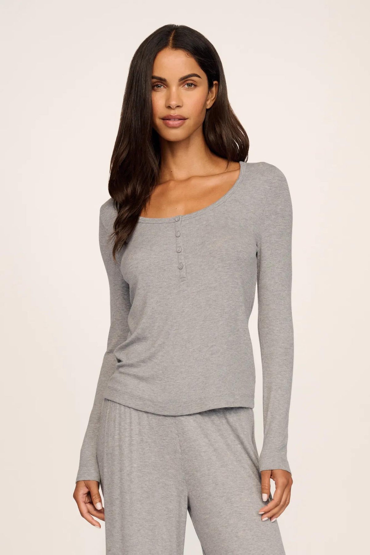 Model is wearing Dream Rib Long Sleeve Henley Tee in Dark Heather Grey