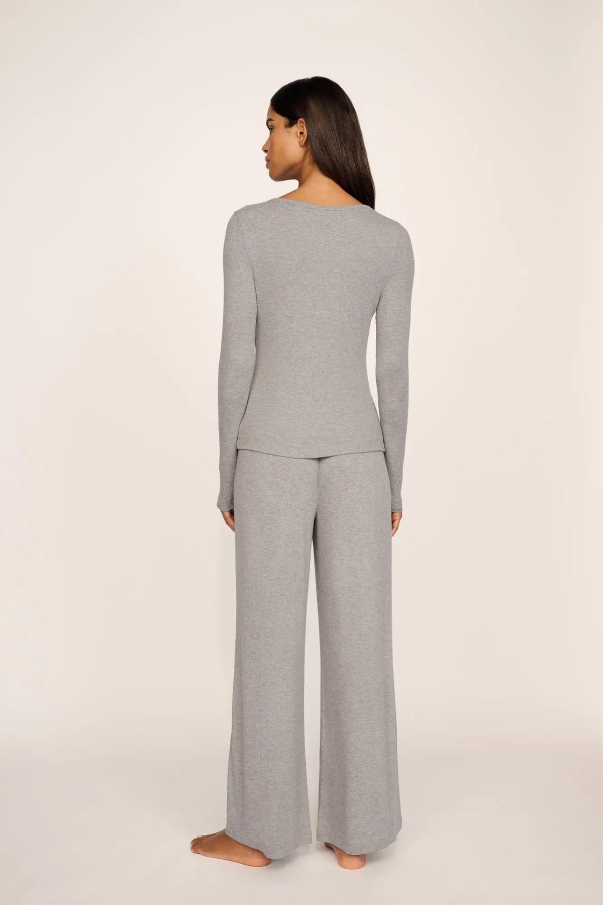 Model is wearing Dream Rib Long Sleeve Henley Tee in Dark Heather Grey