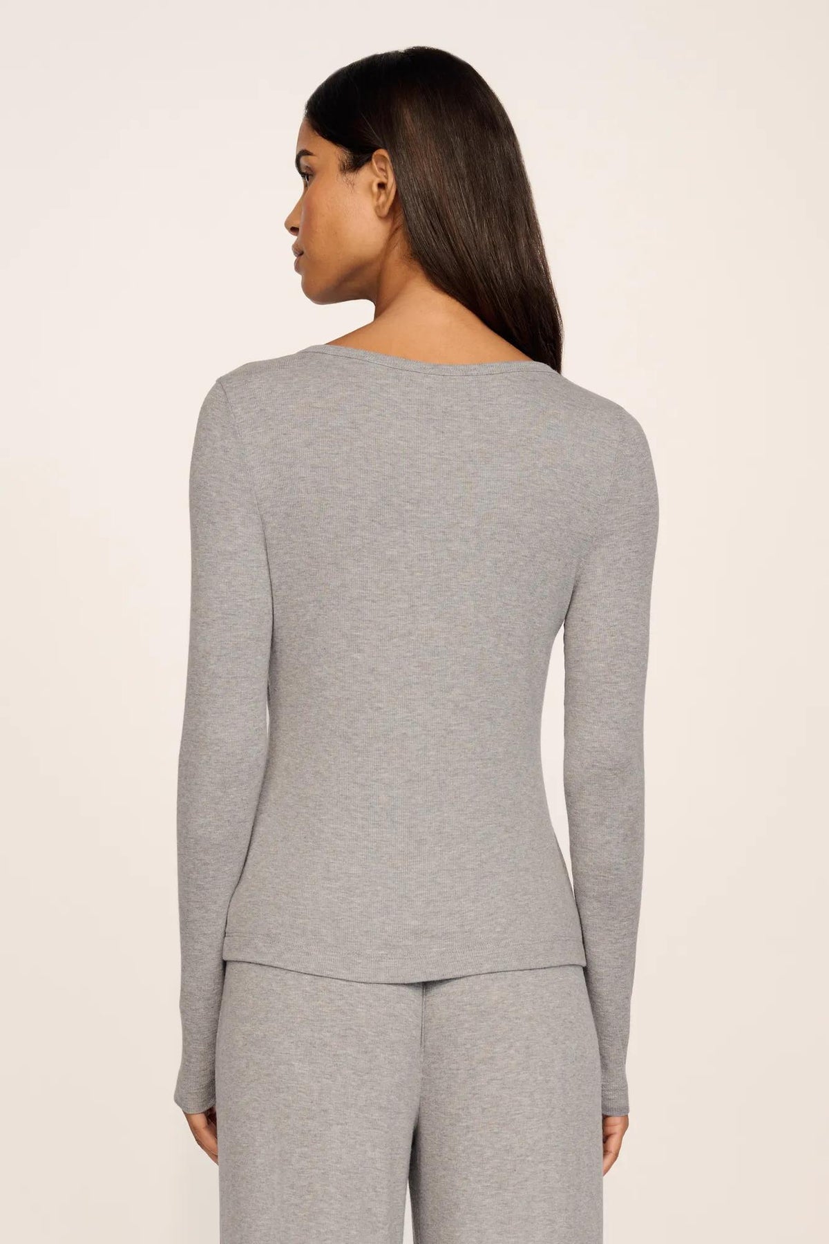 Model is wearing Dream Rib Long Sleeve Henley Tee in Dark Heather Grey