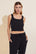 Model wears Recycled Boucle Cropped Tank in Black.