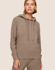 Model is wearing Recycled Boucle Hoodie  in Deep Taupe