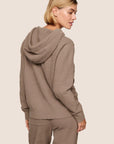 Model is wearing Recycled Boucle Hoodie  in Deep Taupe