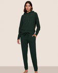 Model is wearing Recycled Boucle Hoodie  in Pine