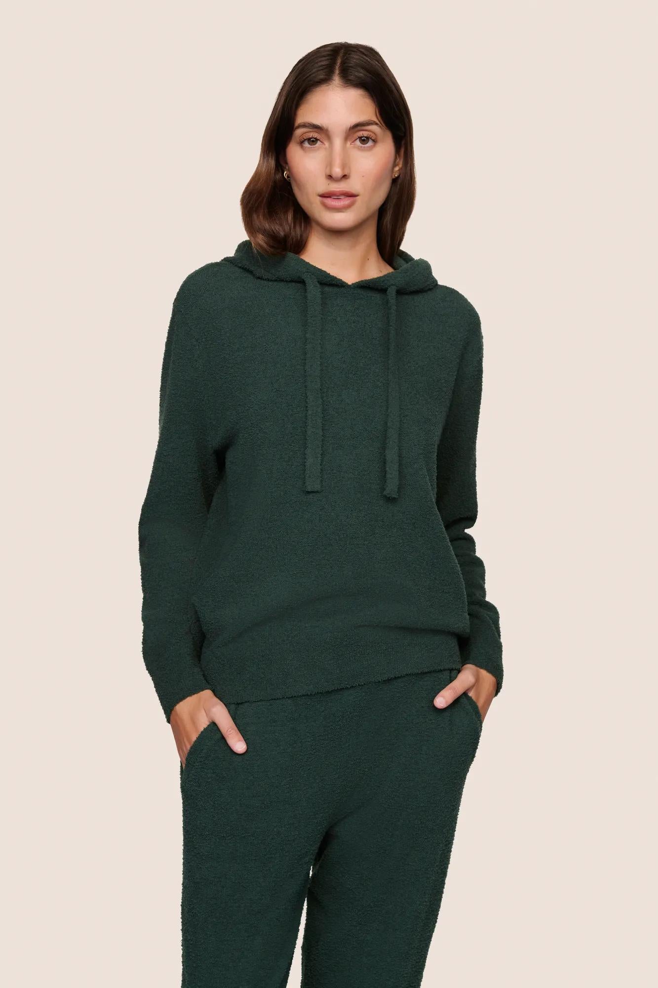 Model is wearing Recycled Boucle Hoodie  in Pine