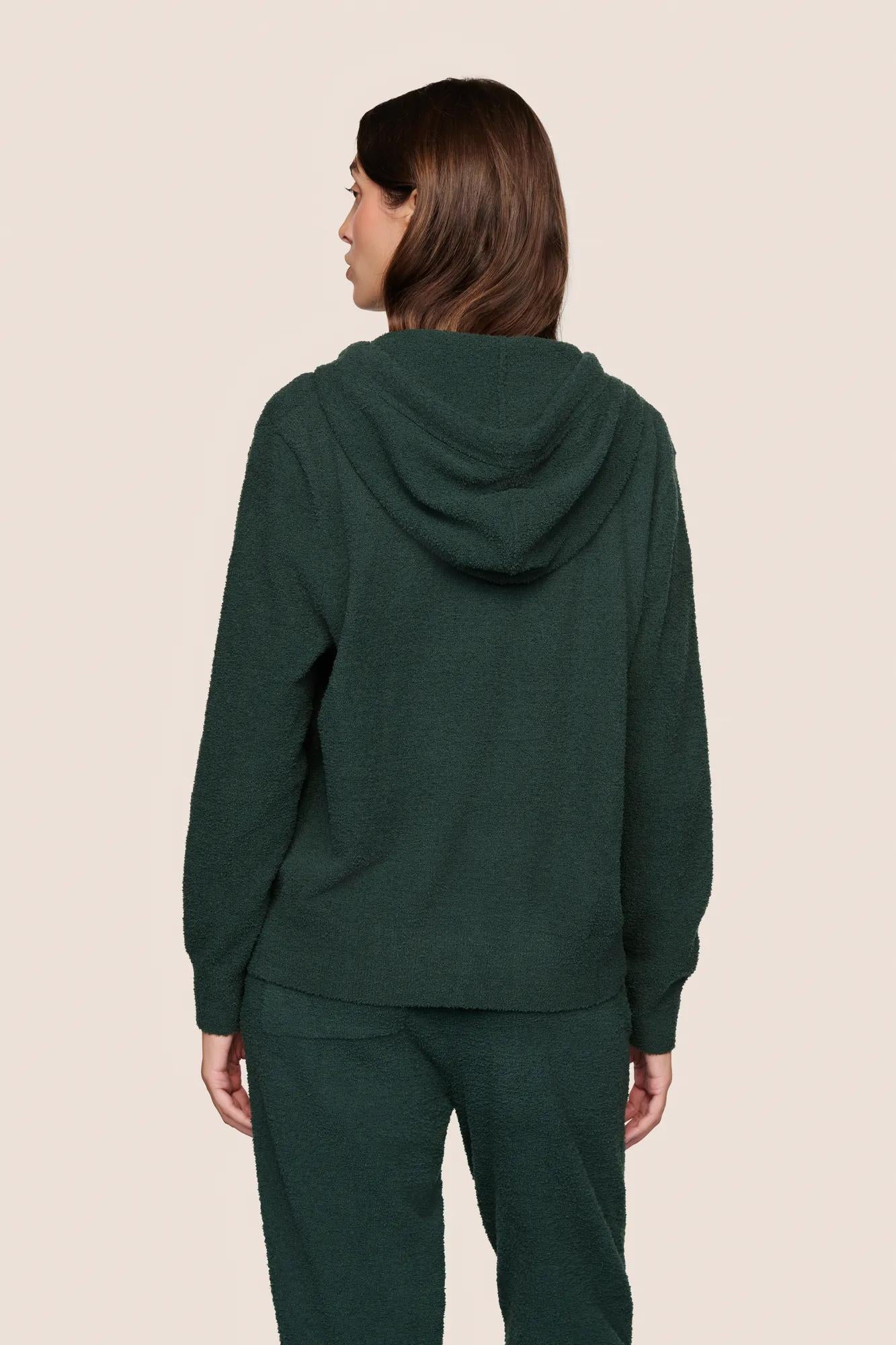 Model is wearing Recycled Boucle Hoodie  in Pine