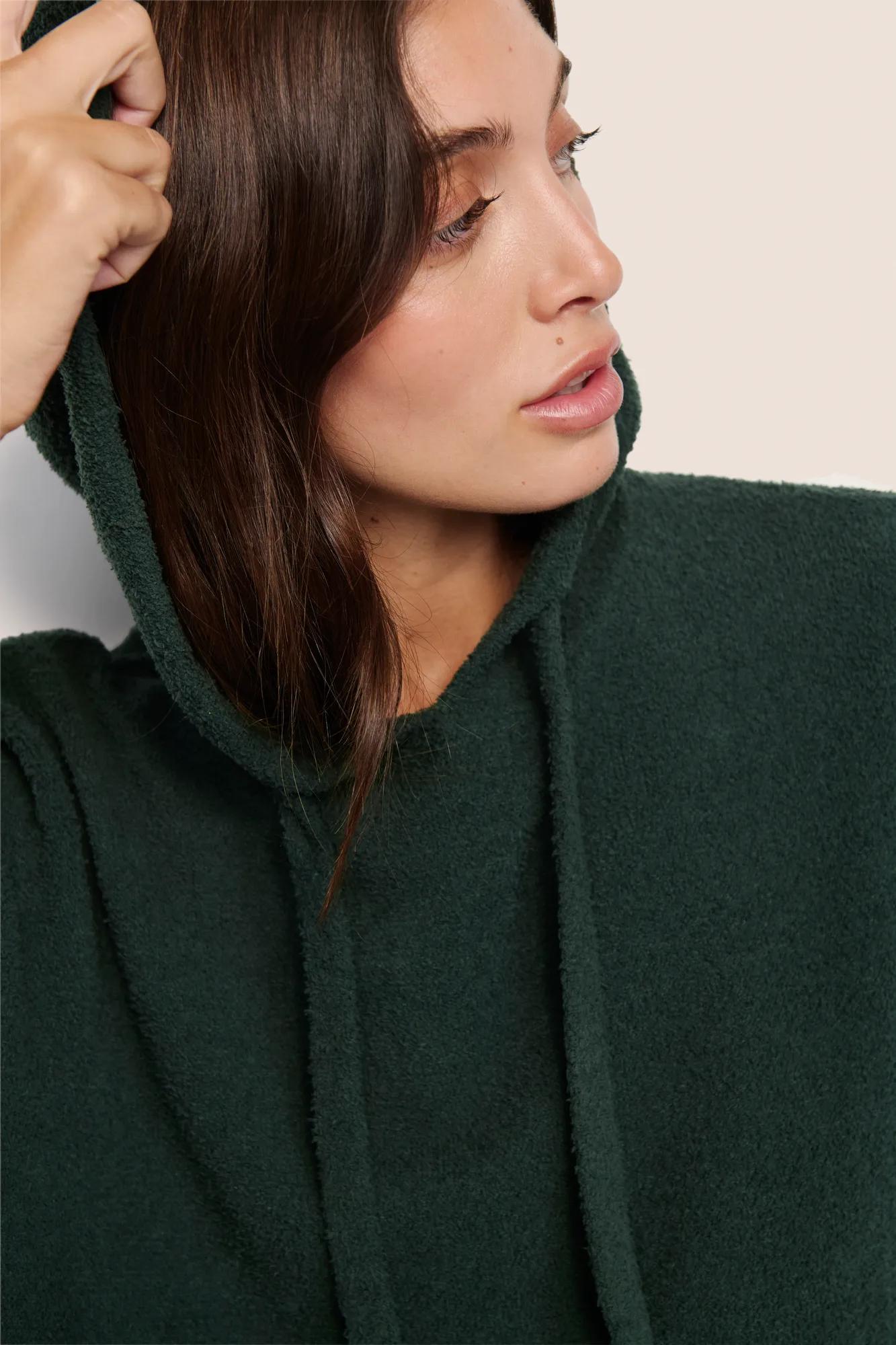 Model is wearing Recycled Boucle Hoodie  in Pine
