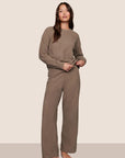 Model is wearing Recycled Boucle Pant  in Deep Taupe