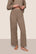 Model is wearing Recycled Boucle Pant  in Deep Taupe
