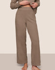 Model is wearing Recycled Boucle Pant  in Deep Taupe