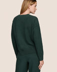 Model is wearing Recycled Boucle Crew Neck Pullover  in Pine