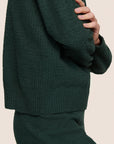 Model is wearing Recycled Boucle Crew Neck Pullover  in Pine