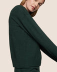 Model is wearing Recycled Boucle Crew Neck Pullover  in Pine