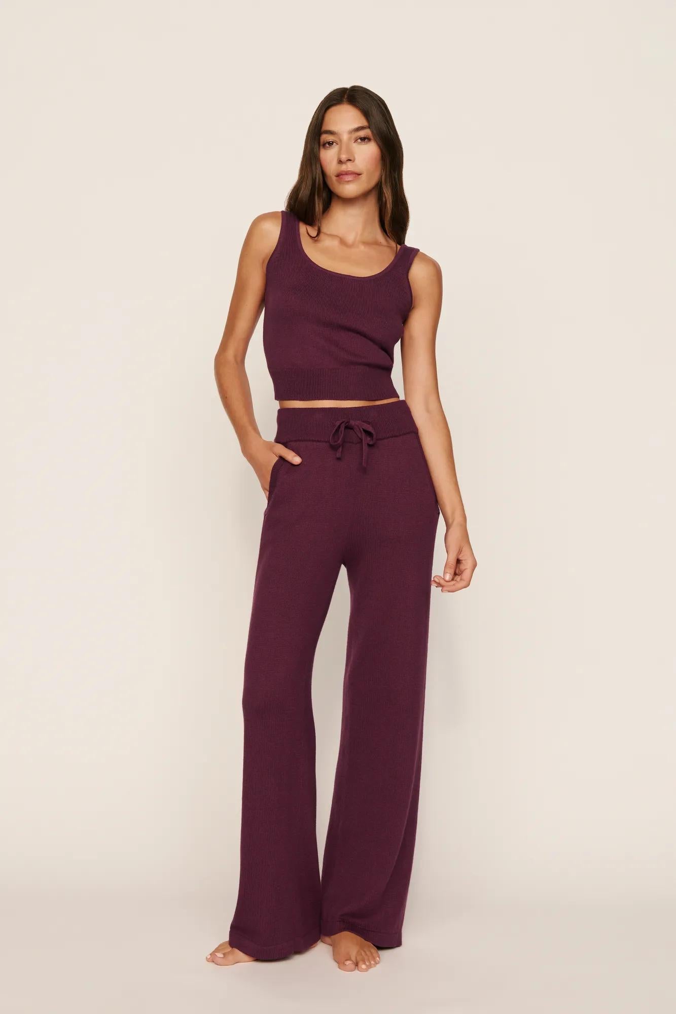Model is wearing Recycled Sweater Pant in Wildberry