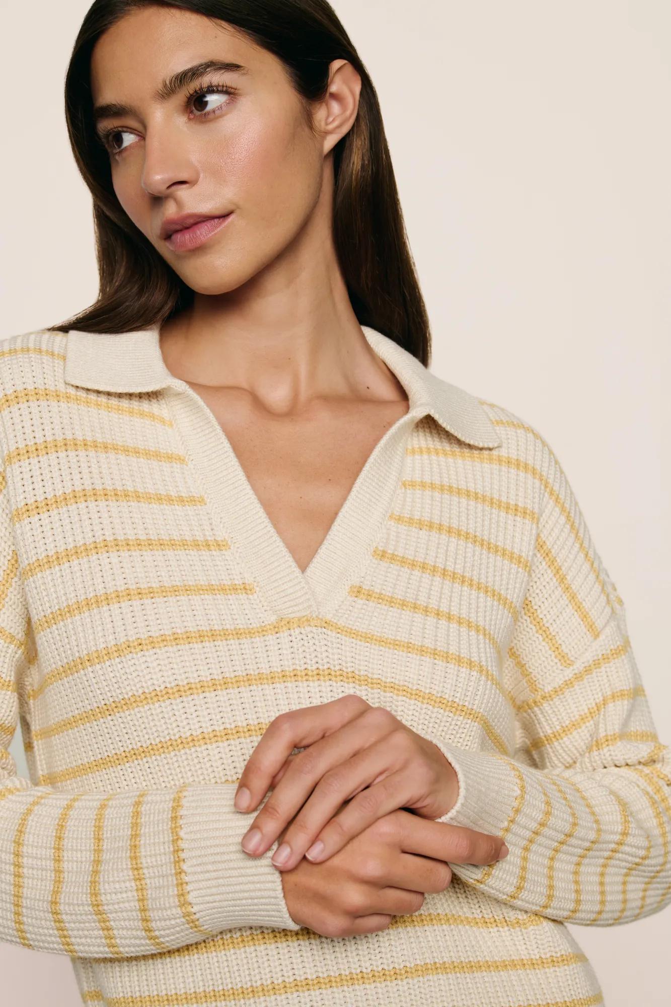 Model is wearing Coastal Cotton Sweater Polo in Stripe Almond Heather/Sunbeam