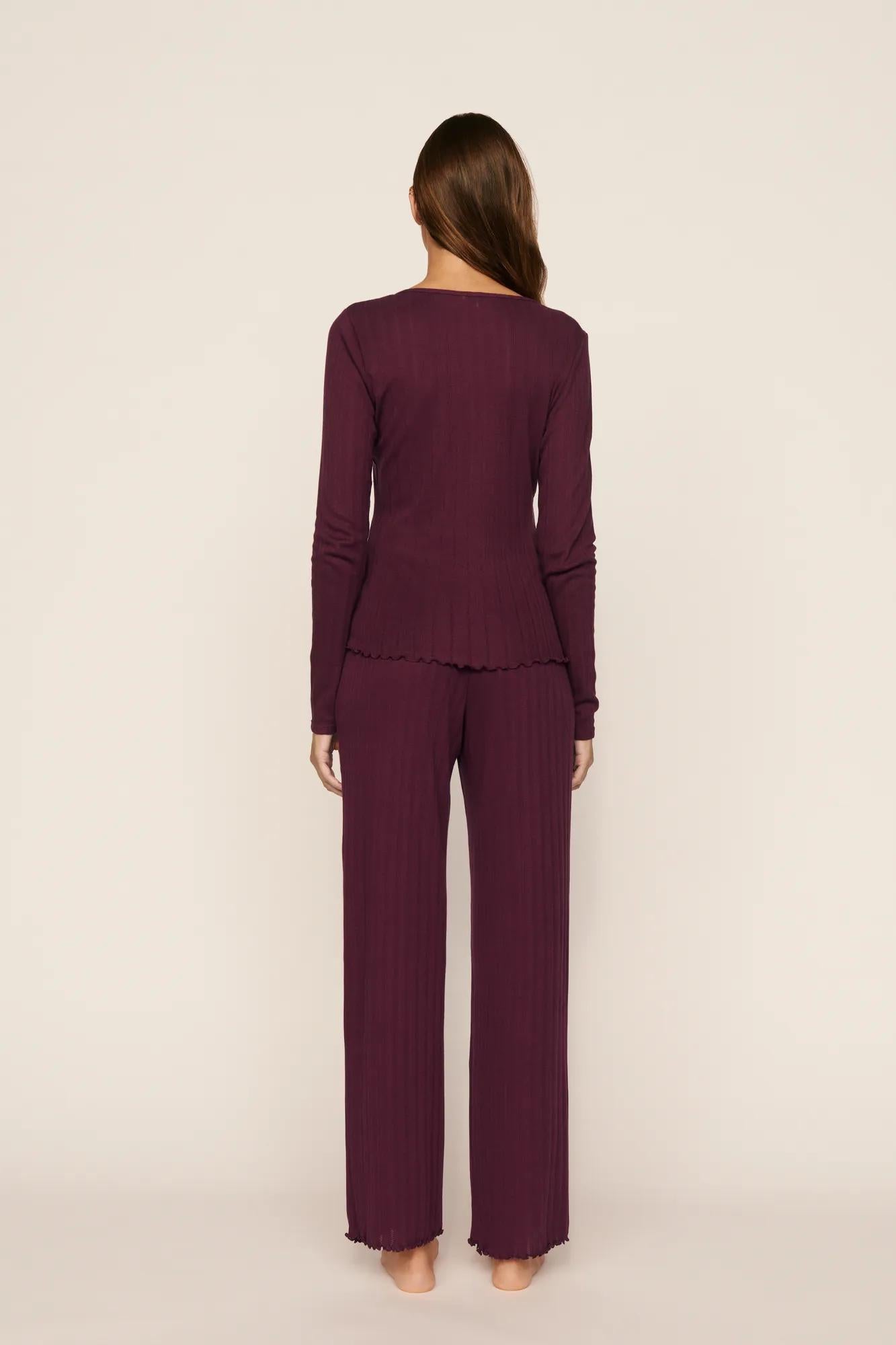 Model is wearing Pointelle V Neck Henley in Wildberry