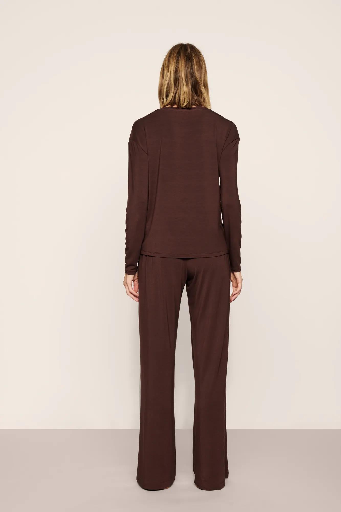 Model is wearing Gisele TENCEL™ Modal Everyday Straight Leg Pant in Chocolate