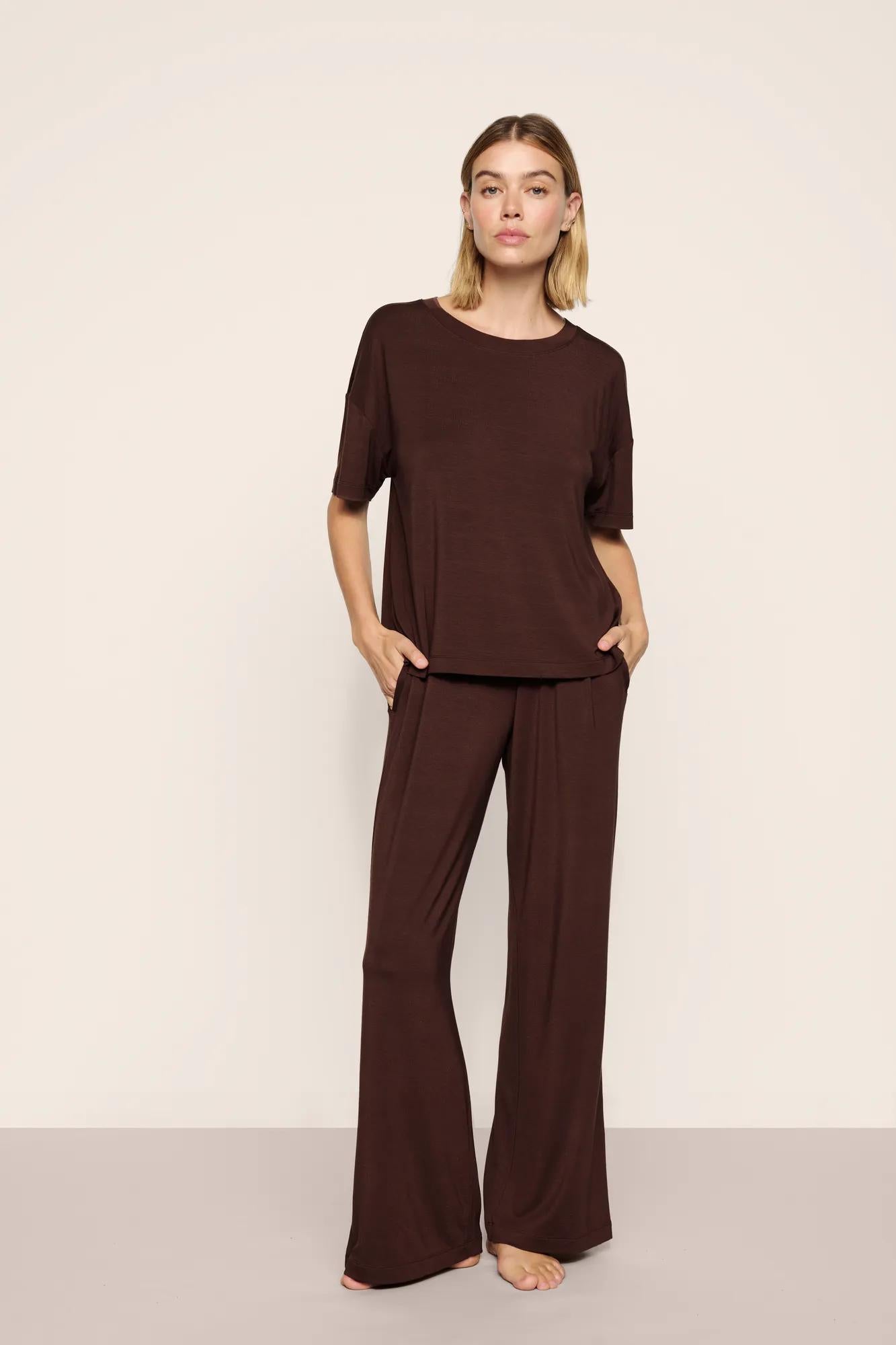 Model is wearing Gisele TENCEL™ Modal Everyday Straight Leg Pant in Chocolate