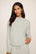 Model is wearing Cozy Time Mock Neck Pullover in Blue Mist