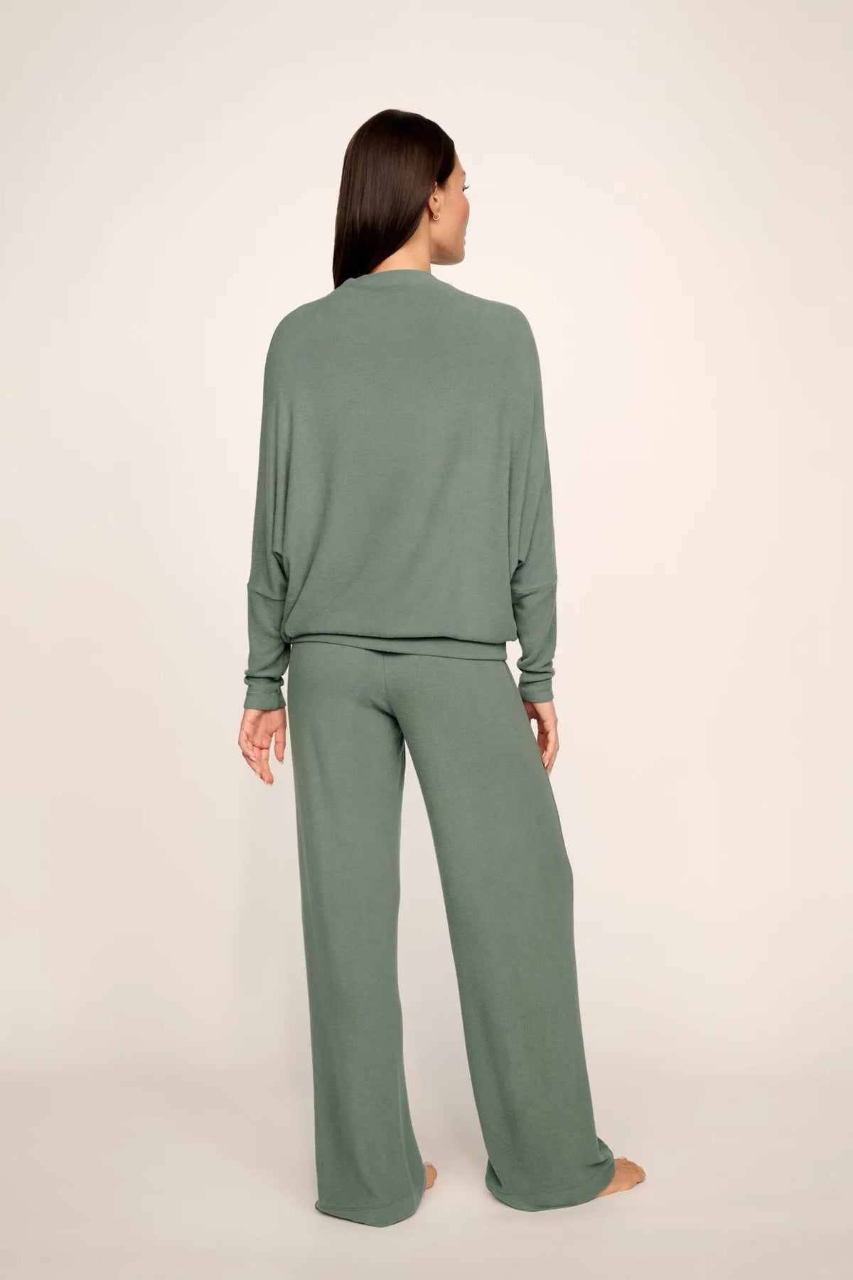 Model is wearing Cozy Time Pant in Desert Sage