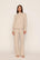 Model is wearing Cozy Time Mock Neck Pullover in Heather French Oak