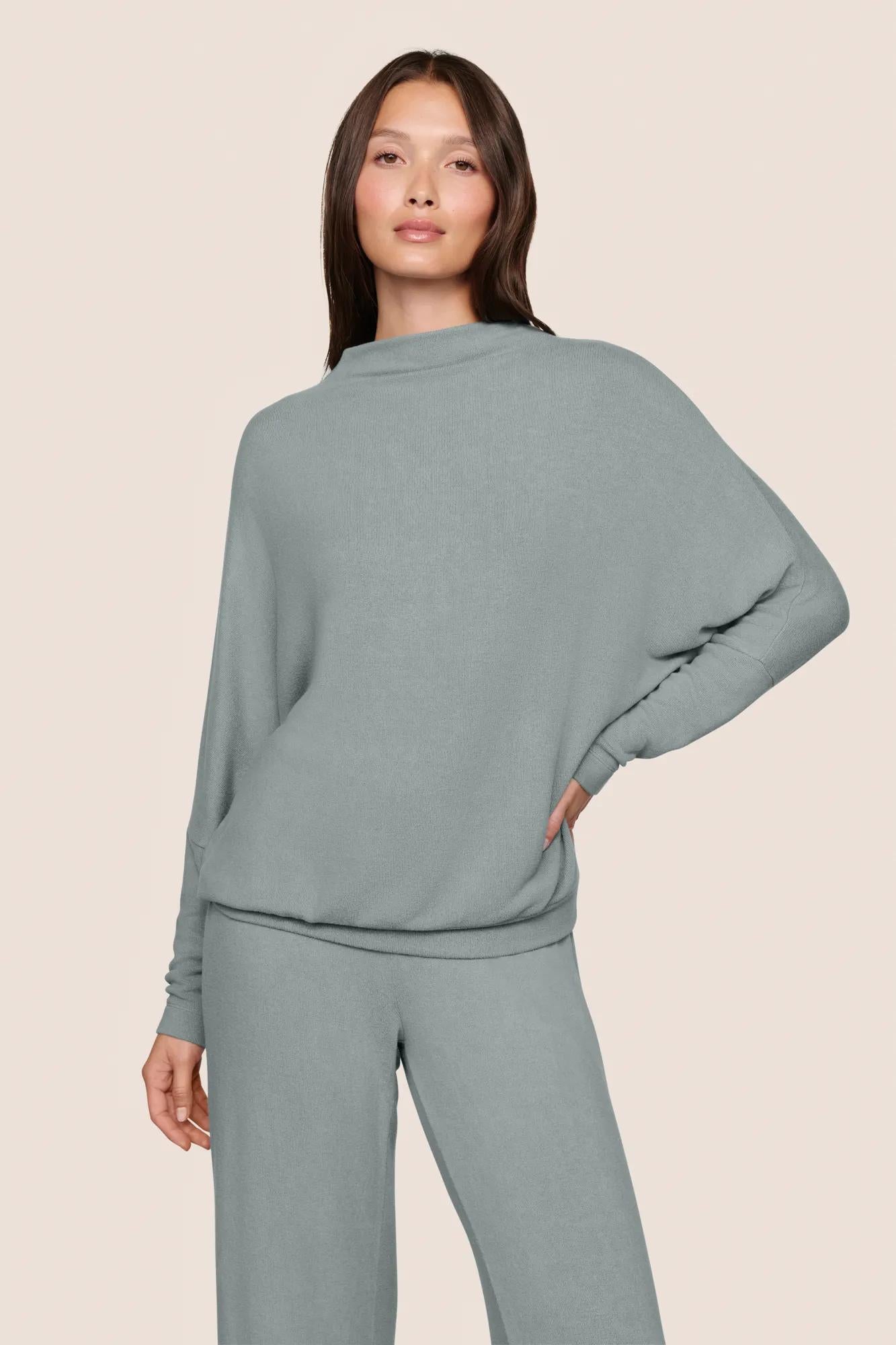 Model is wearing Cozy Time Mock Neck Pullover  in Lead