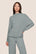 Model is wearing Cozy Time Mock Neck Pullover  in Lead