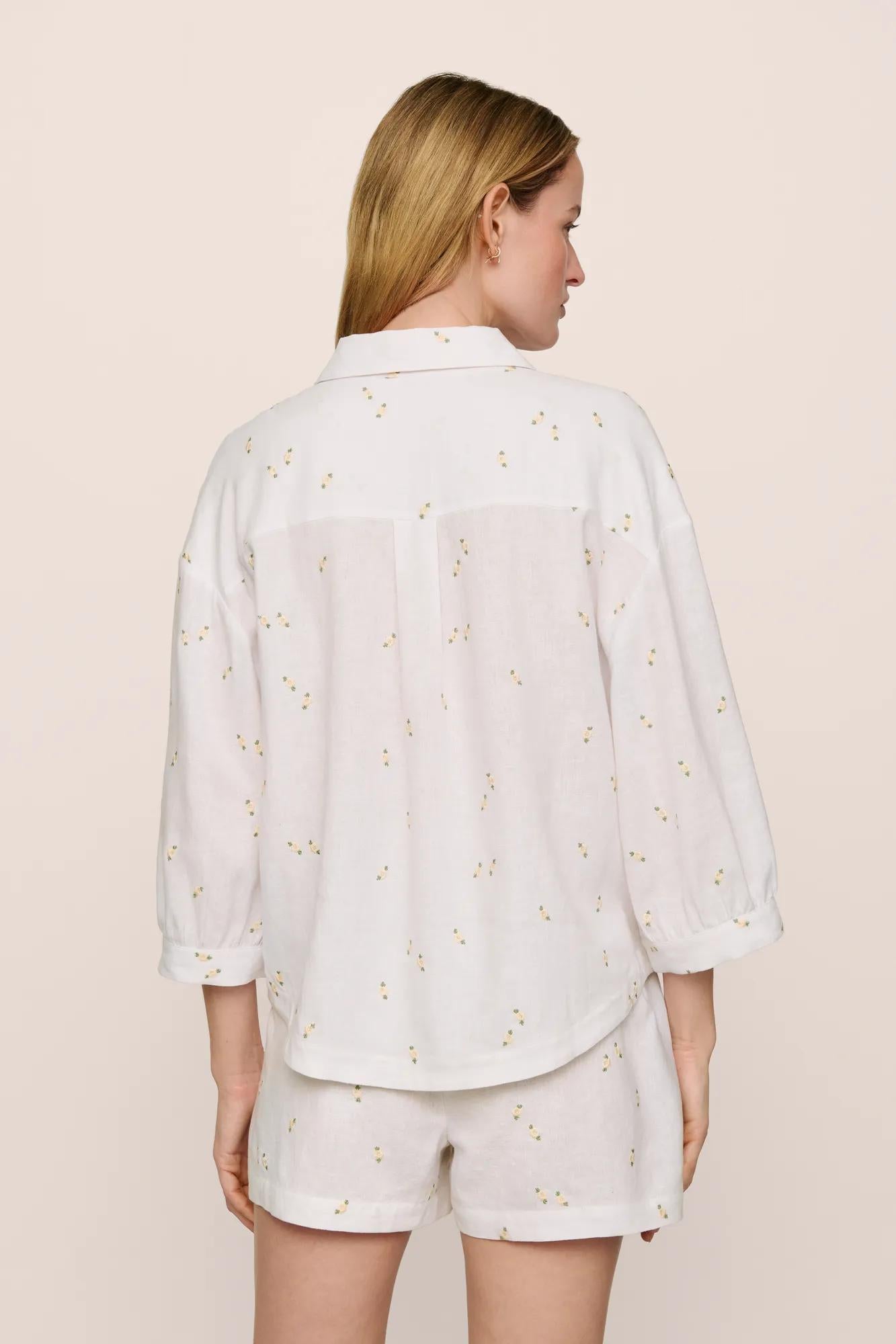Model is wearing Linen Blend Relaxed Quarter Sleeve Top in SummerDaisyWhite/PeachDust