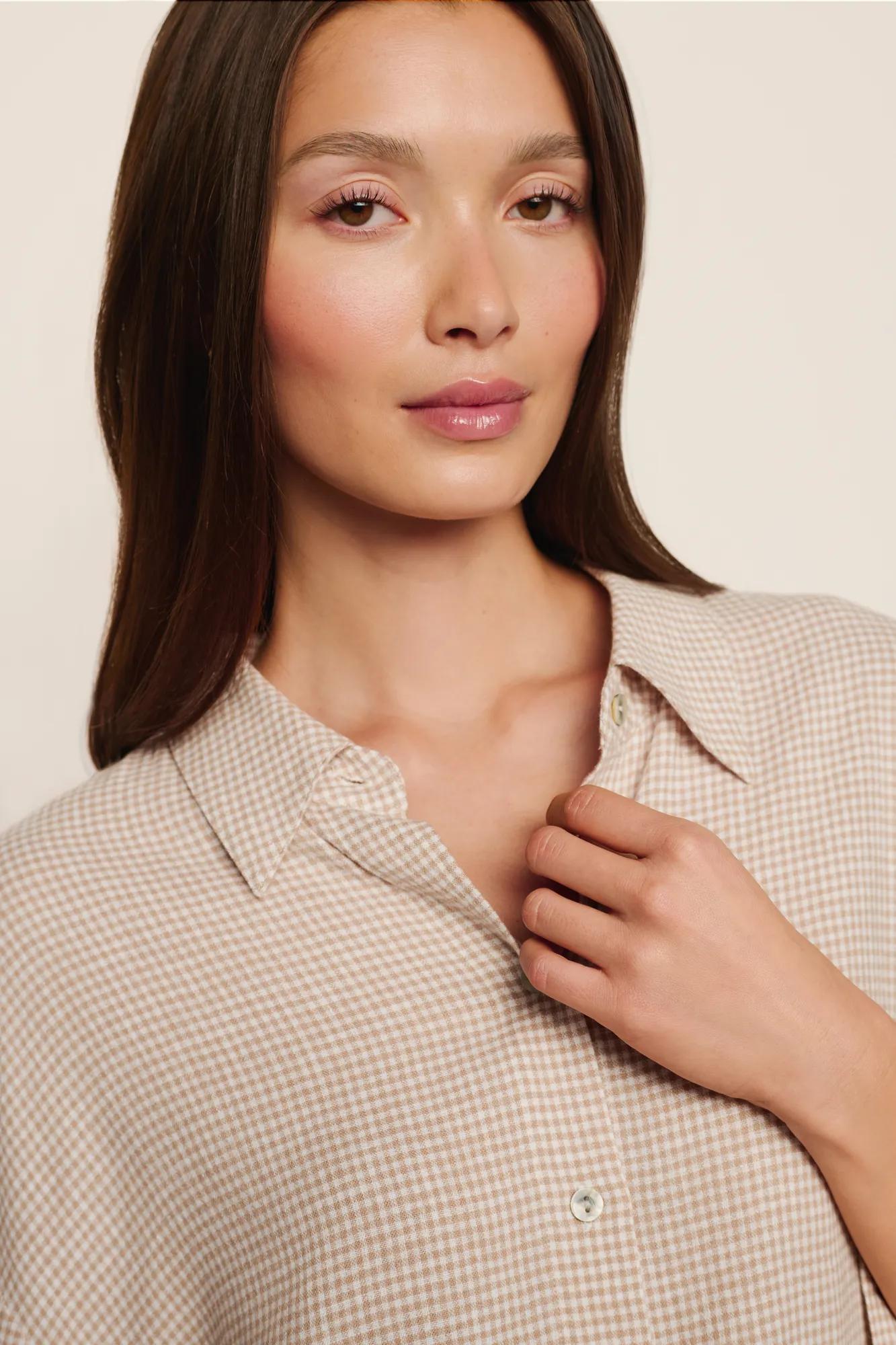 Model is wearing Linen Blend Relaxed Quarter Sleeve Top in Gingham White/Warm Taupe