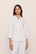 Model is wearing Linen Blend Relaxed Quarter Sleeve Top in White