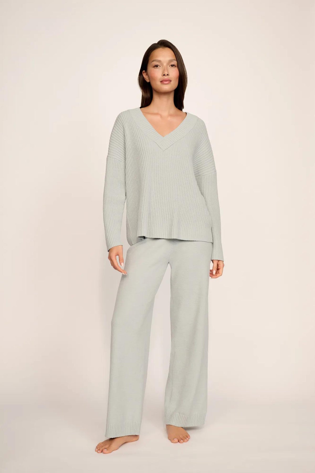 Model is wearing Lightweight Boucle Ribbed V Neck Sweater in Blue Mist