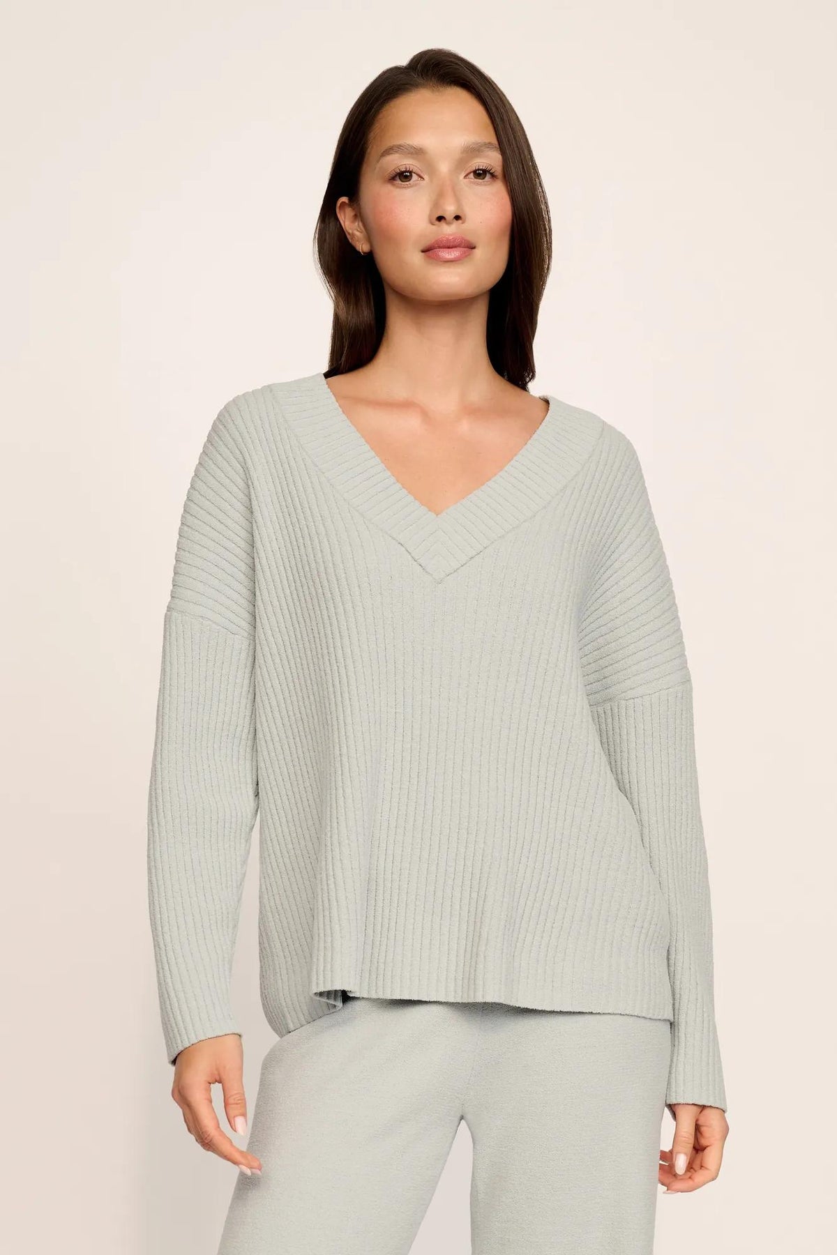 Model is wearing Lightweight Boucle Ribbed V Neck Sweater in Blue Mist