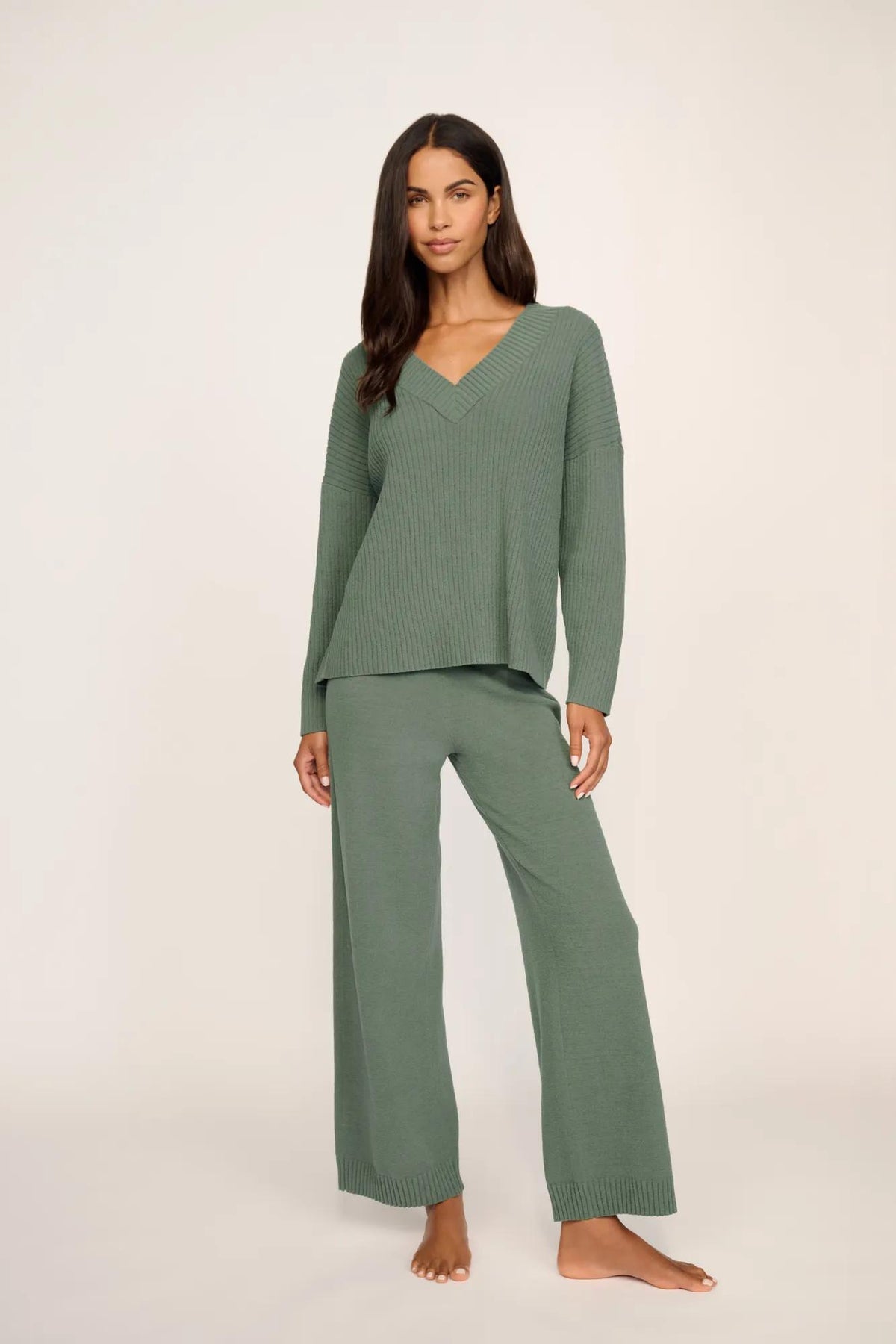 Model is wearing Lightweight Boucle Ribbed V Neck Sweater in Desert Sage