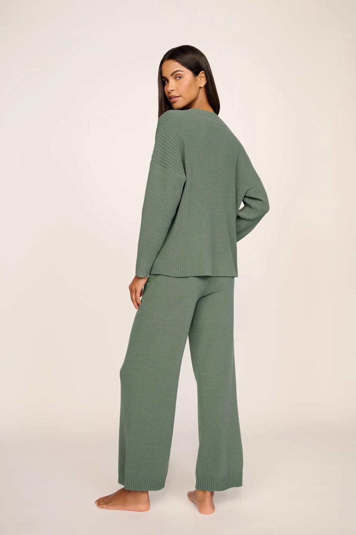 Model is wearing Lightweight Boucle Ribbed V Neck Sweater in Desert Sage