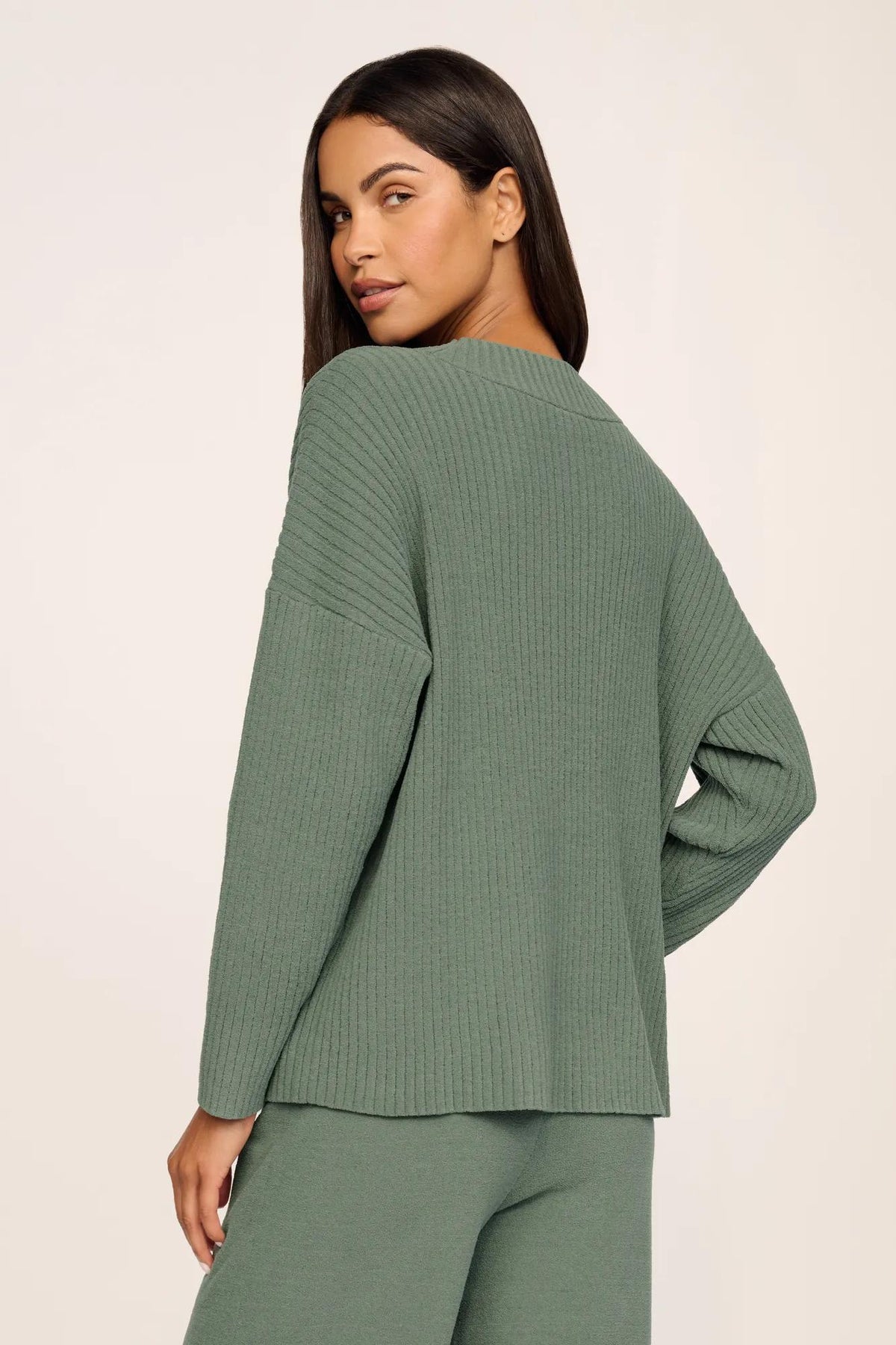 Model is wearing Lightweight Boucle Ribbed V Neck Sweater in Desert Sage