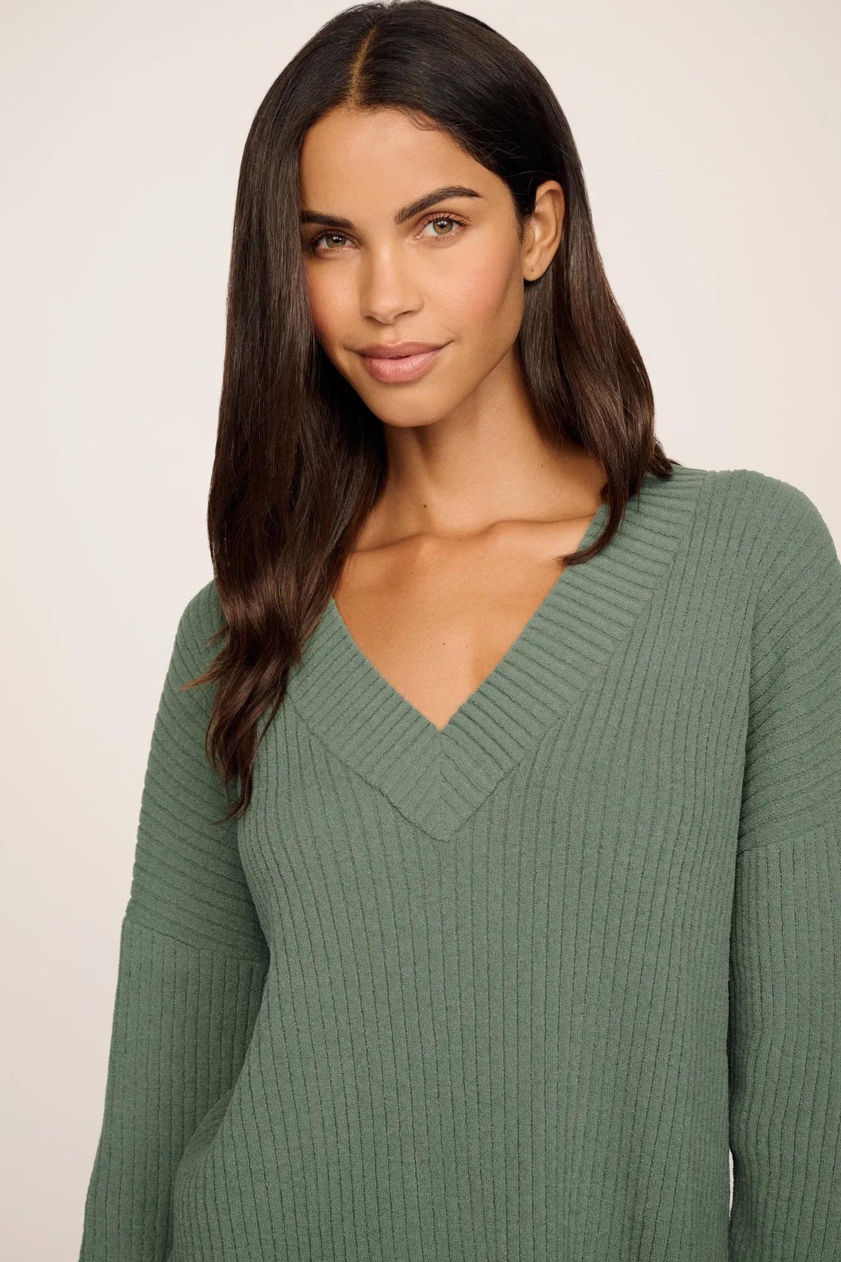 Model is wearing Lightweight Boucle Ribbed V Neck Sweater in Desert Sage