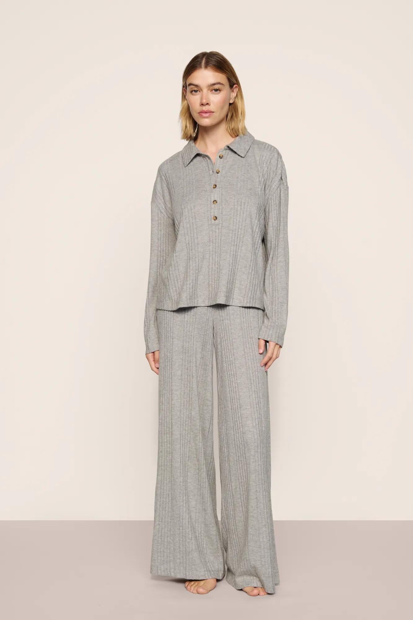 Model is wearing Variegated Rib Long Sleeve Polo in Dark Heather Grey