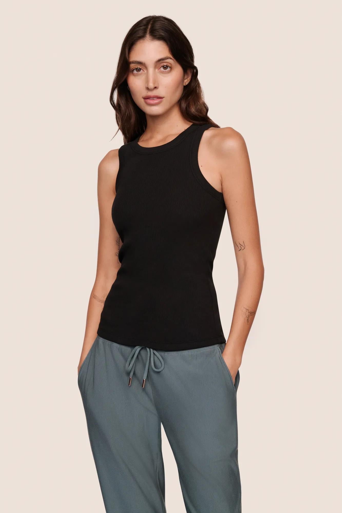 Model is wearing Essential Rib Tank  in Black