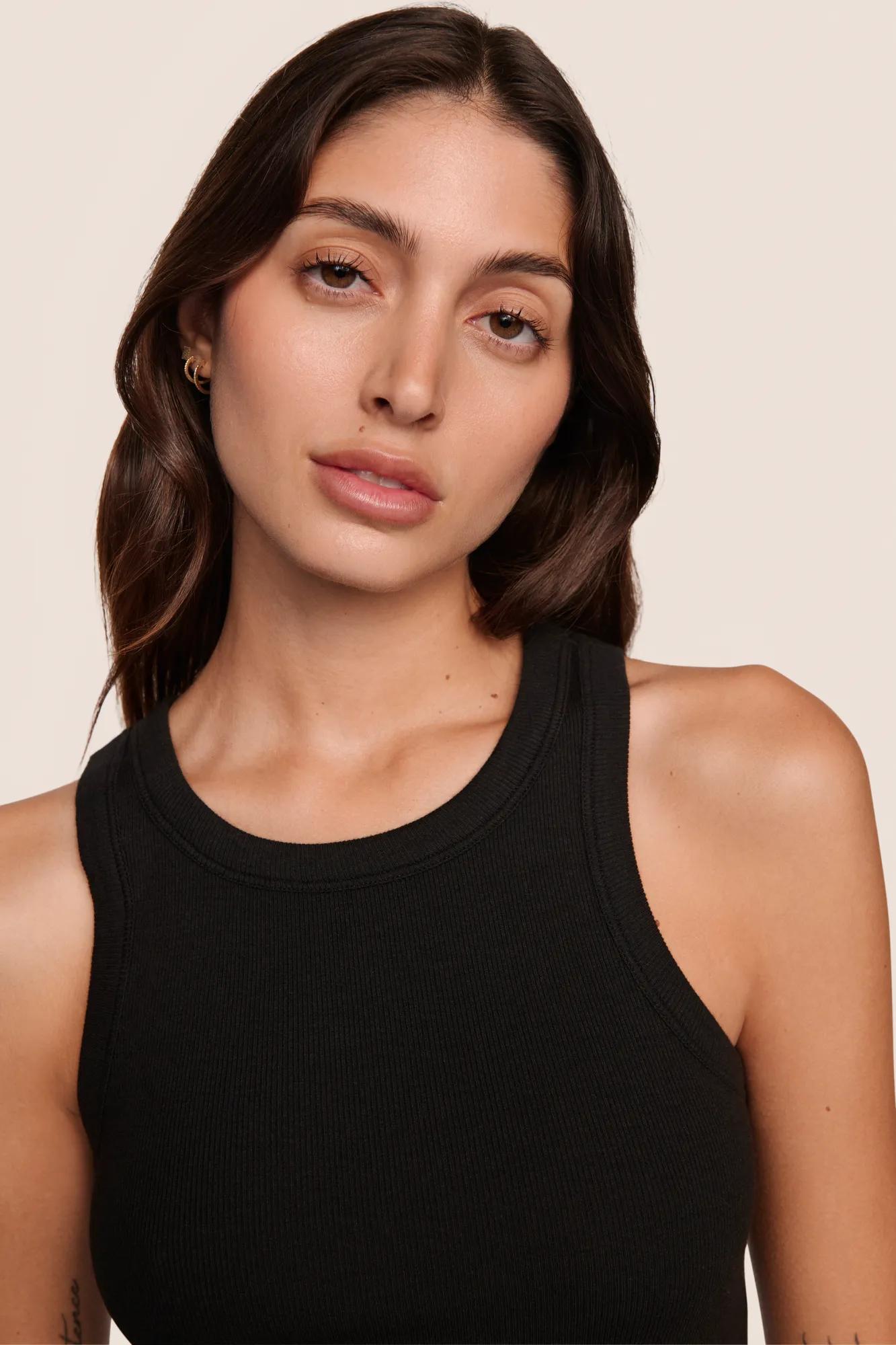 Model is wearing Essential Rib Tank  in Black